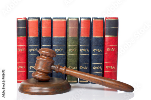 Photo: Wooden gavel and old law books Wooden gavel and old law books