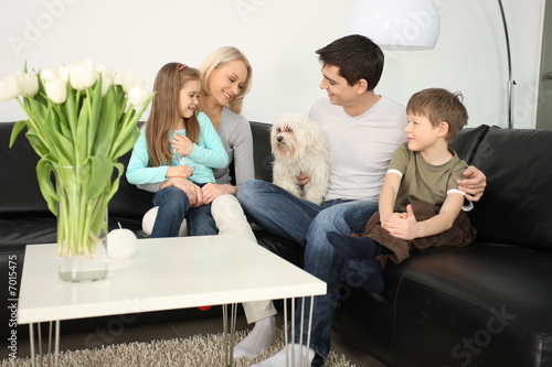 Photo: young family and a dog young family and a dog