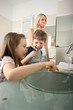 Family brushing teeth 