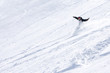 Male snowboarder sliding down the mountain