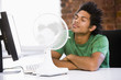 Photo: Office working with electric fan Office working with electric fan