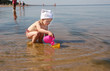 The girl plays on a beach in Jürmala The girl plays on a beach in Jürmala
