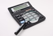 calculator with magnifying glass