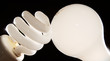 cfl and incandescent lightbulbs on black