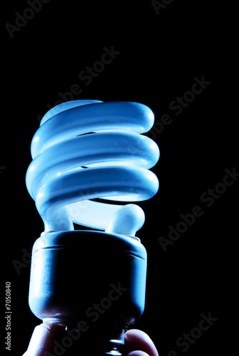 Photo: blue hue of cfl lightbulb on black blue hue of cfl lightbulb on black