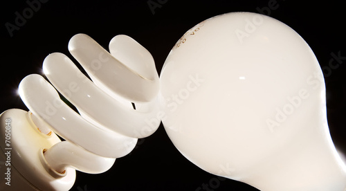Photo: cfl and incandescent lightbulbs on black cfl and incandescent lightbulbs on black
