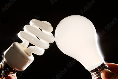Photo: cfl and incandescent lightbulbs on black cfl and incandescent lightbulbs on black