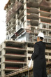Designer Pointing At Building Under Construction Designer Pointing At Building Under Construction