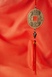 Oriental medallion on the red silk background
