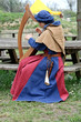a celtic harp player during a medieval fair in Italy