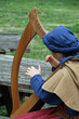 a celtic harp player during a medieval fair in Italy