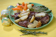 Roast lamb with baked potato, carrot, leek and asparagus