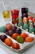Many coloured Easter eggs and glasses filled with colour