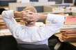 Photo: Businessman relaxing at desk Businessman relaxing at desk