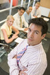 Photo: Male executive at head of boardroom table Male executive at head of boardroom table