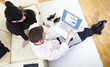Businesspeople working on laptop