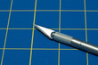 Stainless steel razor knife on a blue cutting knife Stainless steel razor knife on a blue cutting knife