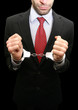 business man with red necktie and black suit in handcuffs