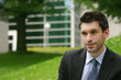 portrait of a young business man in the park