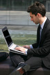 business man working on his laptop outdoor