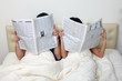 Photo: Couple reading newspapers Couple reading newspapers