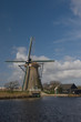 Dutch windmill at Kinderdijk against blue sky