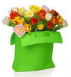green bag with beautiful tulip bouquet . isolated on white 