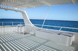 ship deck with striped  shadowon on blue sea background