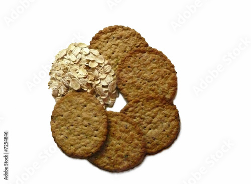 Photo: Oats and cereal crackers on white background Oats and cereal crackers on white background