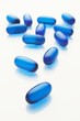 Blue capsules on white background
