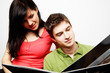 young happy couple with photo album