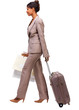Businesswoman walking with travel luggage