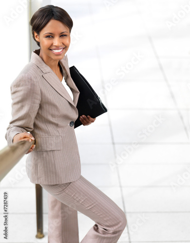 Photo: Businesswoman holding folder Businesswoman holding folder