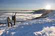 Foto: Couple enjoying the sunshine in the mountains Couple enjoying the sunshine in the mountains