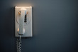 white telephone mounted on a wall white telephone mounted on a wall