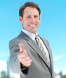 Portrait of a businessman ready for hand shake