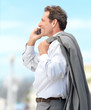 Photo: Man using mobile phone Man using mobile phone