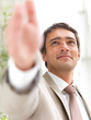 Portrait of a businessman, open hand