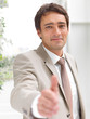 Portrait of a businessman, open hand