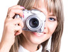 Young woman with digital camera