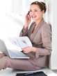 Business woman working and talking on phone