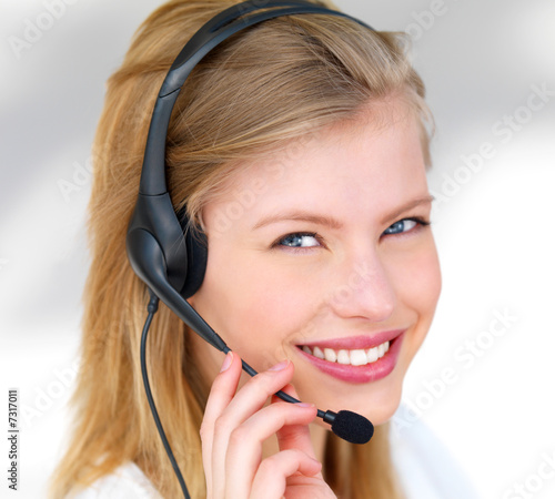 Young happy woman wearing headset