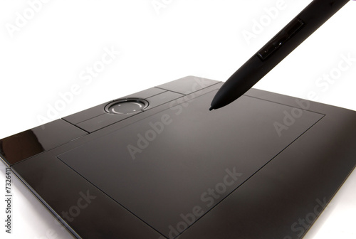 Photo: graphic tablet and pen on white background graphic tablet and pen on white background