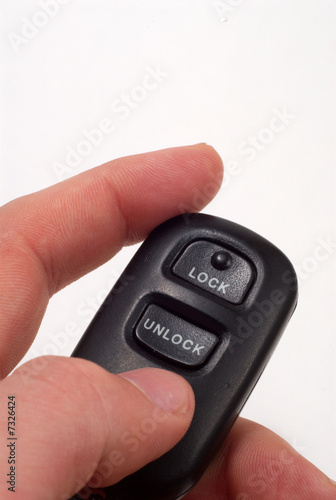 Photo: A car''s unlock button on key ring. A car''s unlock button on key ring.