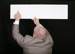 man pointing to blank sign