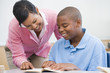 Elementary school teacher helping pupil