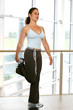 Beautiful fitness trainer doing hamstring stretches 