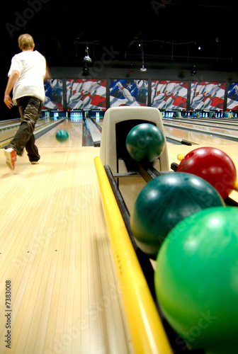 Photo: A bowling alley with balls in the rack A bowling alley with balls in the rack