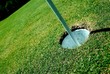 Golf course hole on green