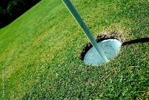 Photo: Golf course hole on green Golf course hole on green